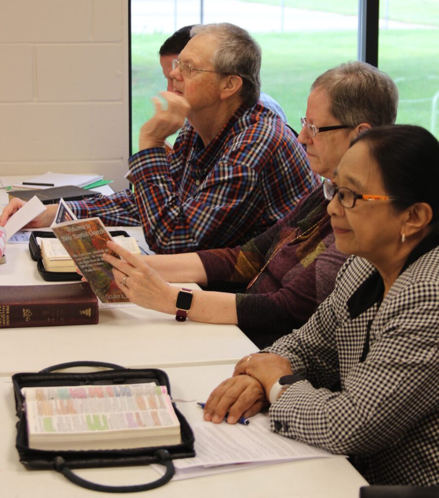 People in a Sunday school class. We base all of our teaching upon the Bible.