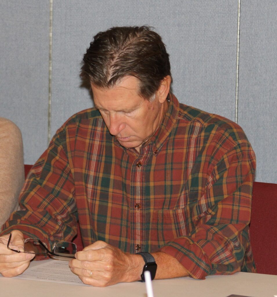 A member of BBCCU praying in a Bible study.